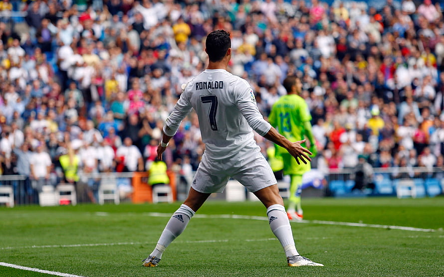 Cristiano Ronaldo in Real Madrid Kit Preparing for a Free Kick on the Pitch HD wallpaper