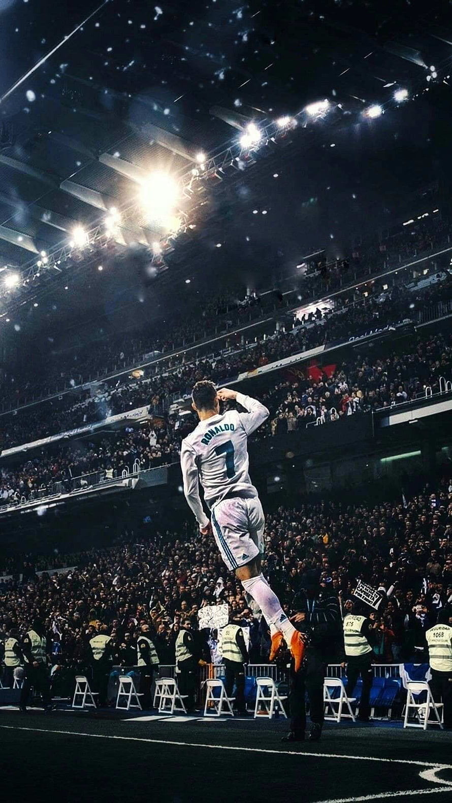 Cristiano Ronaldo celebrating a goal in a white jersey under stadium lights HD phone wallpaper