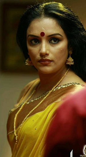 Hema Malini in a yellow and red saree with traditional gold jewelry and bindi HD phone wallpaper