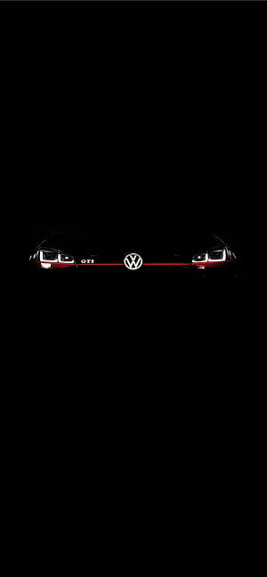Volkswagen Golf GTI Front View With Red Stripe And Headlights In Dark HD phone wallpaper