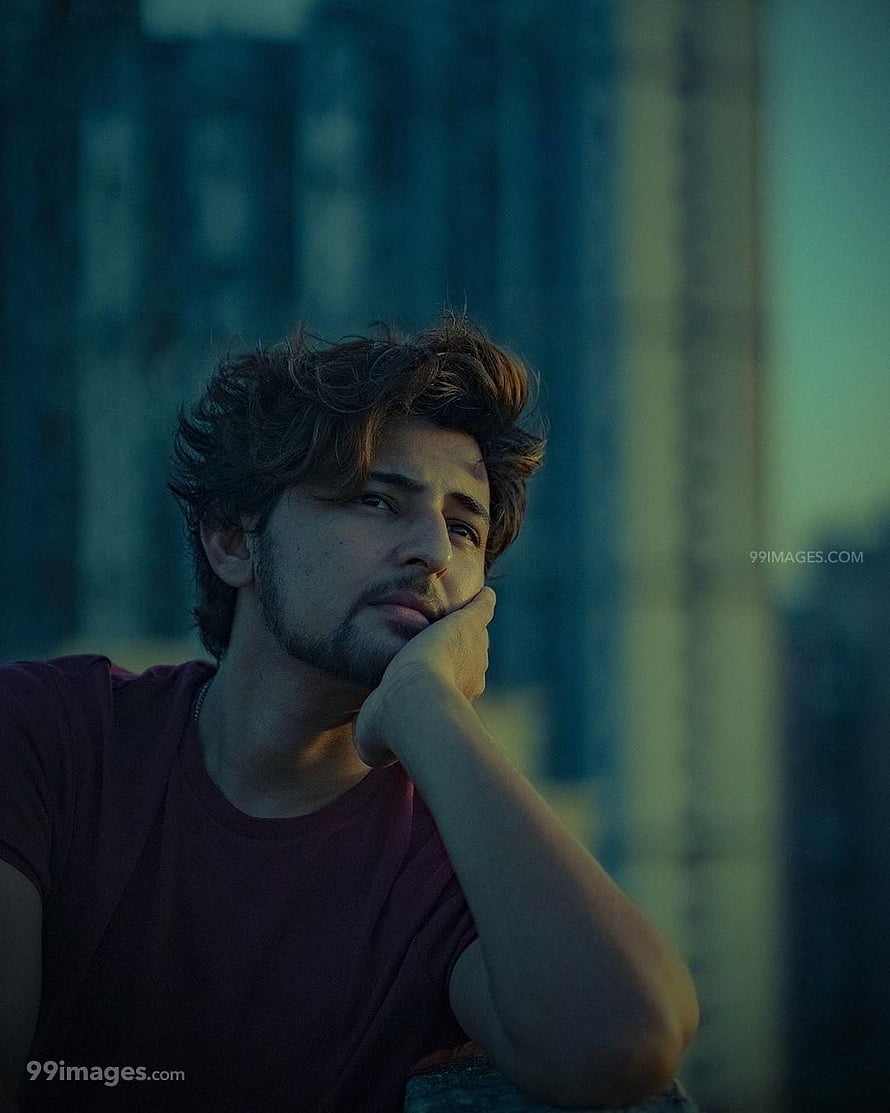 Darshan Raval Pensive Portrait Against Urban Skyline HD phone wallpaper