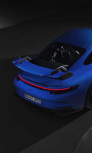 Rear View of Blue Porsche 911 GT3 with Active Spoiler and Red Light Bar HD phone wallpaper