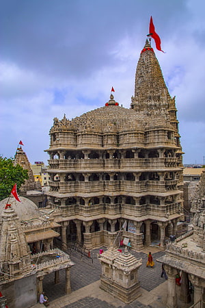 Ancient Dilwara Jain Temple Intricate Marble Architecture and Red Flags HD phone wallpaper