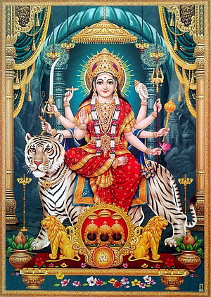 Maa Durga riding a tiger with multiple arms holding weapons and a conch shell in a traditional Indian painting HD phone wallpaper
