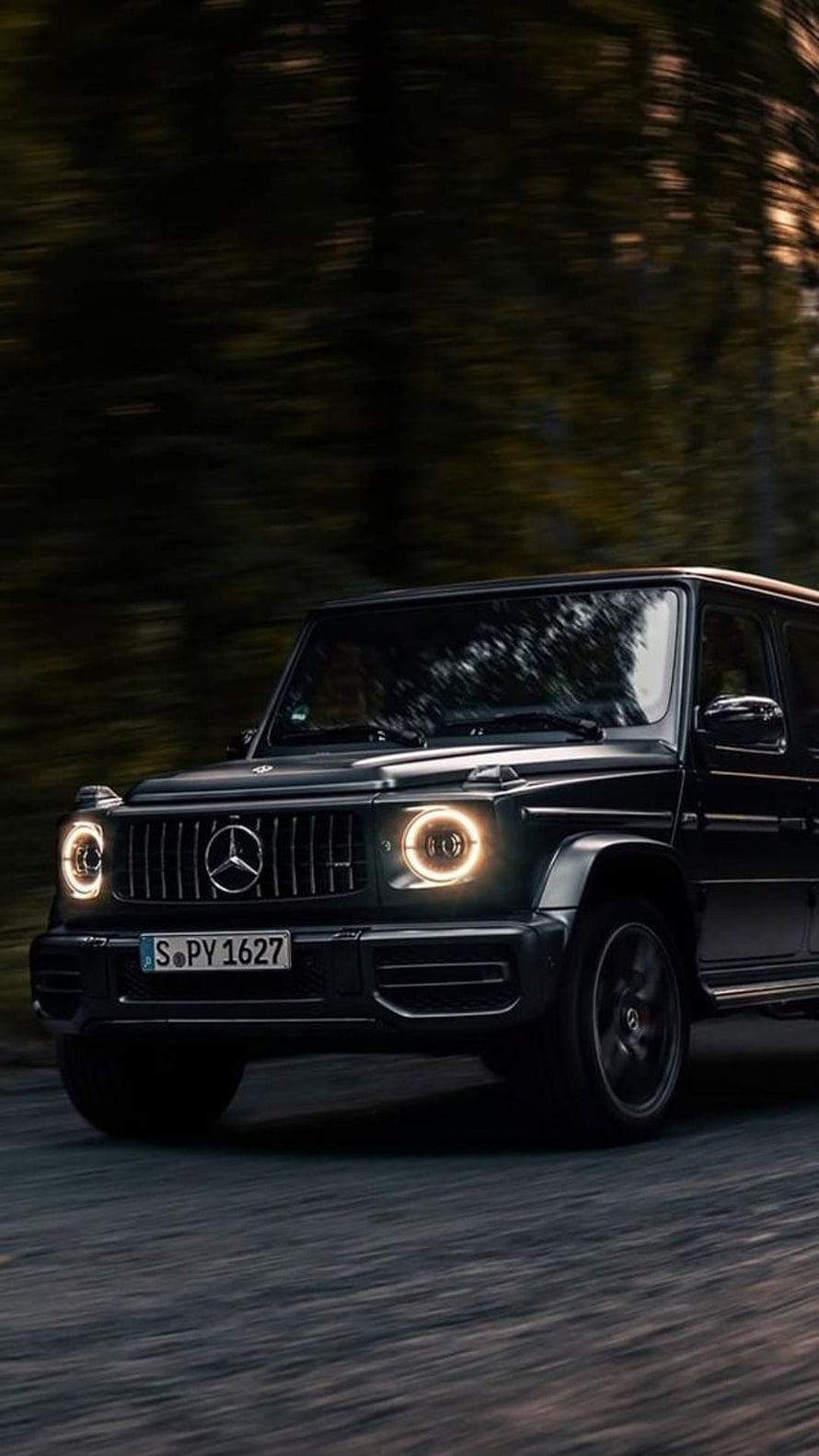 Black Mercedes-Benz G-Class SUV Driving on Forest Road HD phone wallpaper