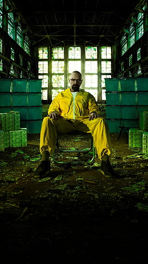 Breaking Bad Walter White in Yellow Hazmat Suit Sitting Amidst Stacks of Cash in Abandoned Warehouse HD phone wallpaper