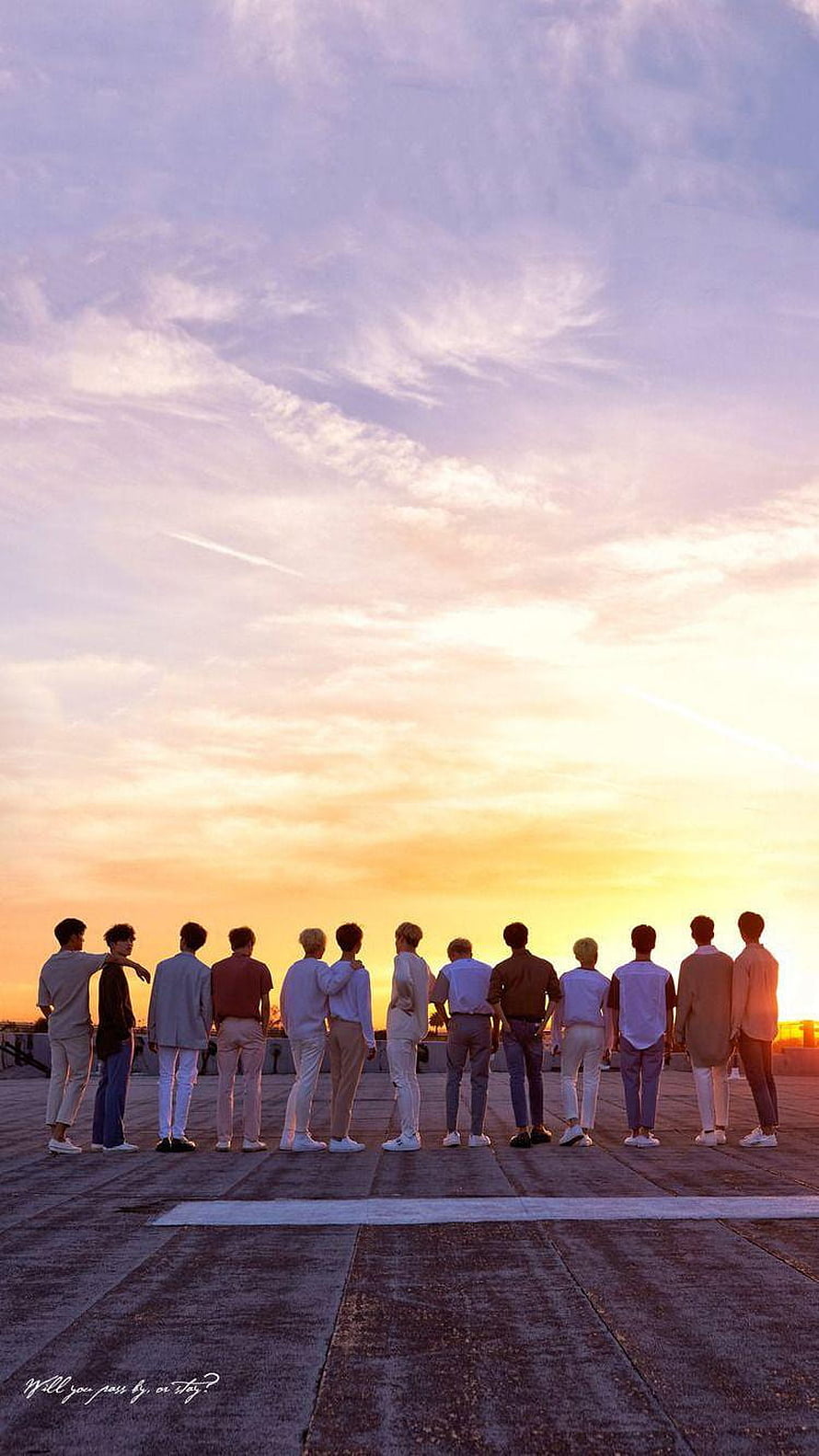 Seventeen Members Standing Together on Rooftop at Sunset HD phone wallpaper