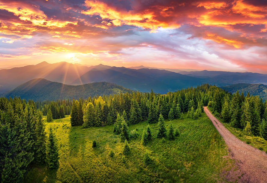 Sunset Over Mountain Forest With Dirt Road And Golden Sky HD wallpaper