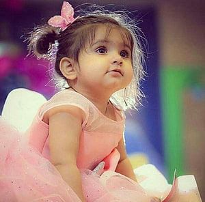 Adorable Toddler in Pink Tutu Dress with Butterfly Hair Accessory HD wallpaper
