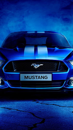 Front View of a Blue Ford Mustang with Racing Stripes in Dramatic Blue Lighting HD phone wallpaper