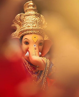 Close-up Portrait of Lord Ganesha with Golden Crown and Traditional Adornments HD phone wallpaper