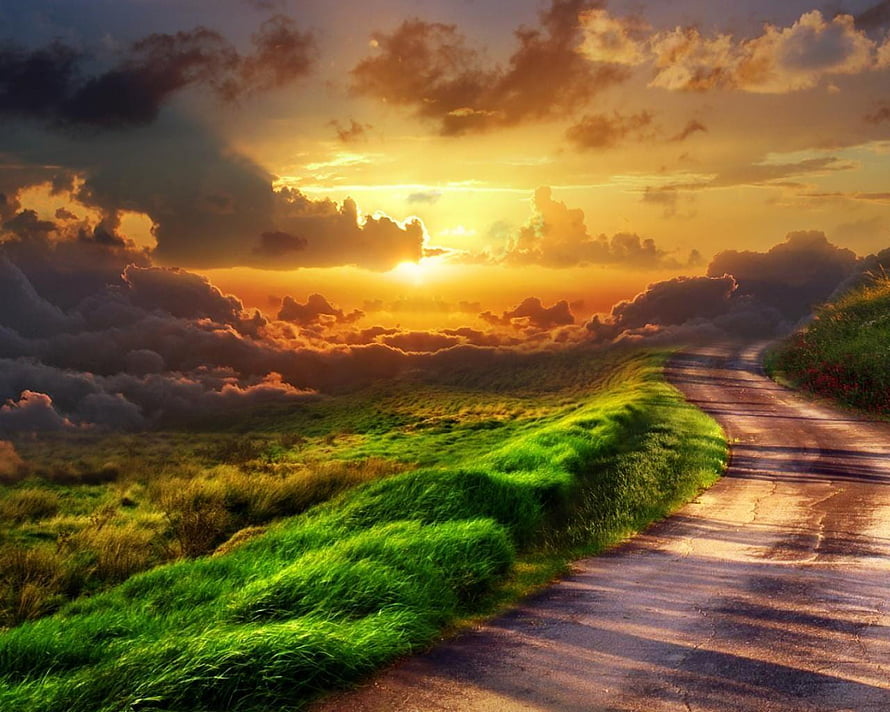 Sunset Road Through Green Hills with Dramatic Clouds and Golden Sky HD wallpaper