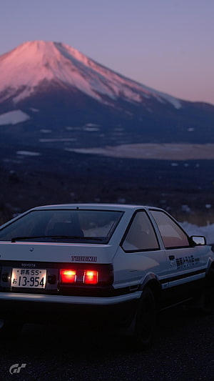 White Toyota Trueno AE86 Parked Before Snow-Capped Mount Fuji at Dusk HD phone wallpaper