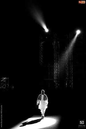 Narendra Modi Walking Under Spotlight in Dramatic Black and White Portrait HD phone wallpaper