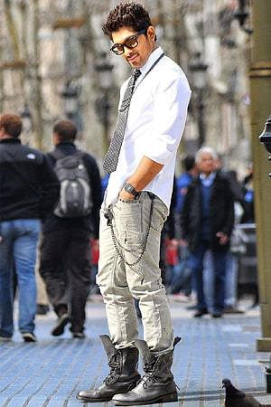 Allu Arjun in White Shirt, Polka Dot Tie, and Distressed Jeans on a City Street HD phone wallpaper