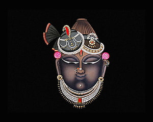 Traditional Indian Kathakali Face Art with Intricate Jewelry and Makeup HD wallpaper