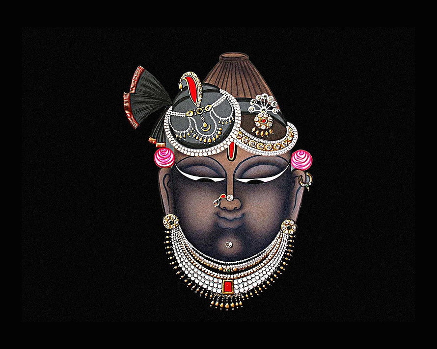 Traditional Indian Kathakali Face Art with Intricate Jewelry and Makeup HD wallpaper