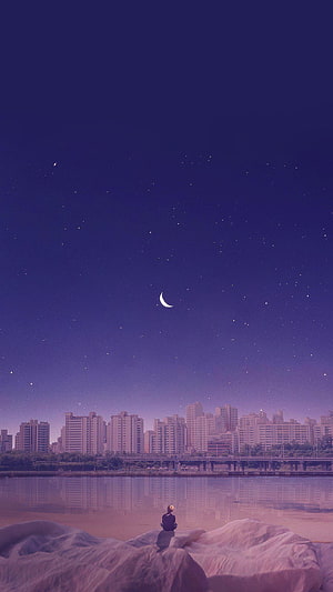 Solitary figure gazing at a crescent moon over a starry night city skyline and river HD phone wallpaper