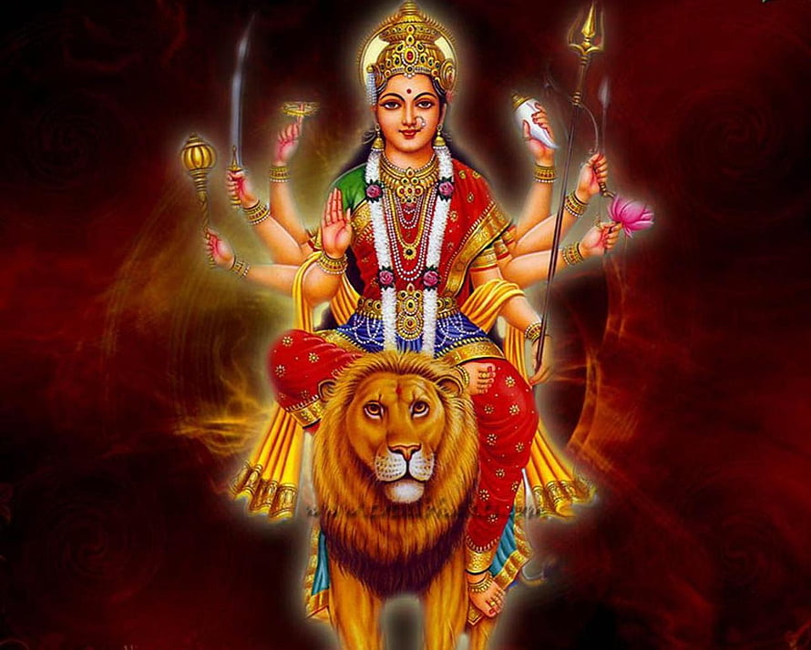 Goddess Durga Riding a Lion with Multiple Arms and Divine Weapons HD wallpaper