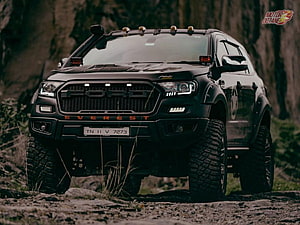 Black Ford Everest Off-Road SUV with Custom Grille and Roof Lights on Rocky Terrain HD wallpaper