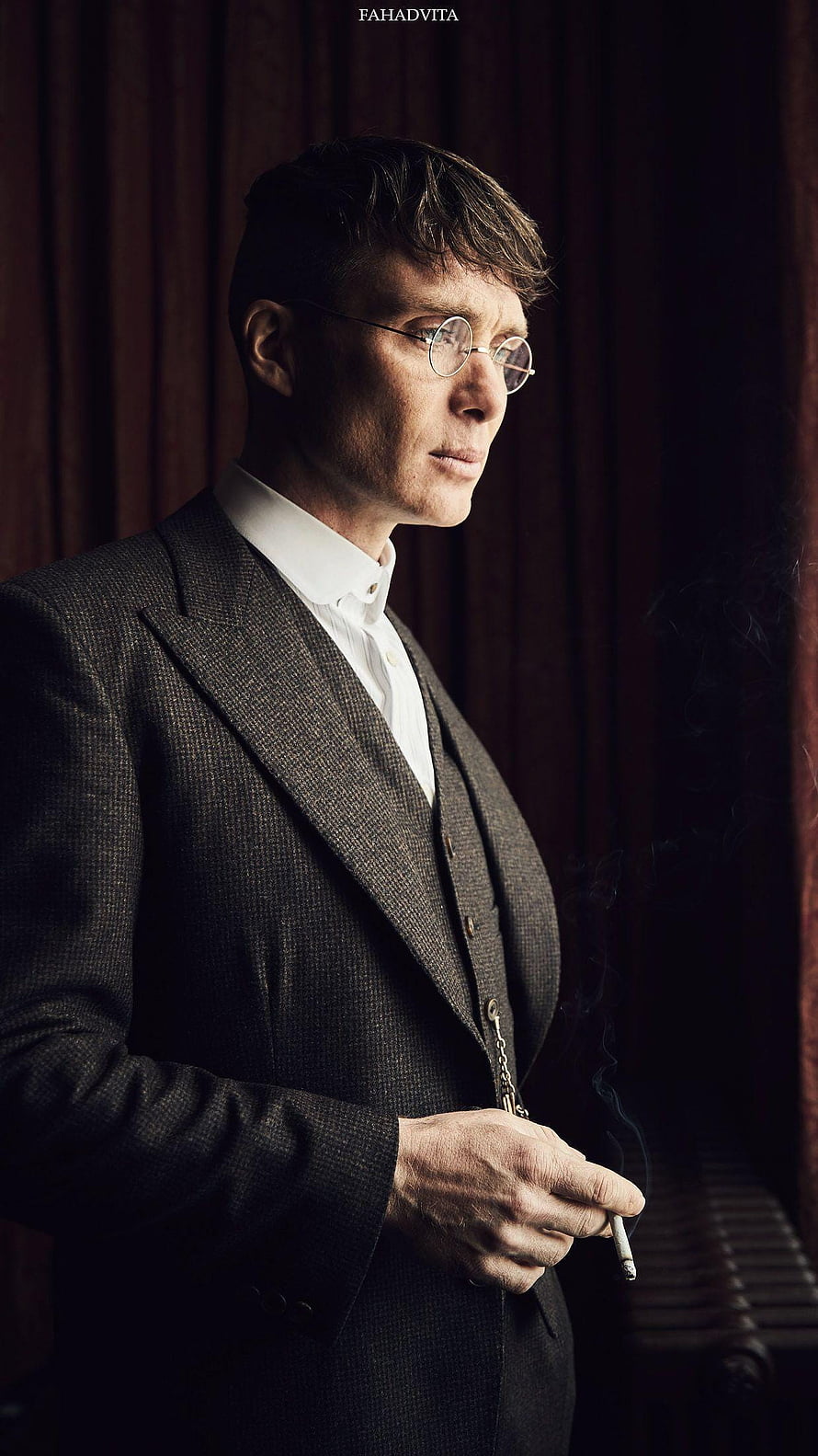 Thomas Shelby from Peaky Blinders in a dark suit smoking a cigarette HD phone wallpaper
