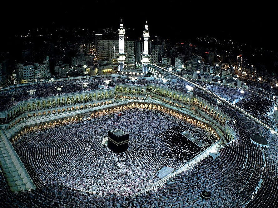 Aerial Night View of the Kaaba and Grand Mosque in Makkah During Tawaf HD wallpaper
