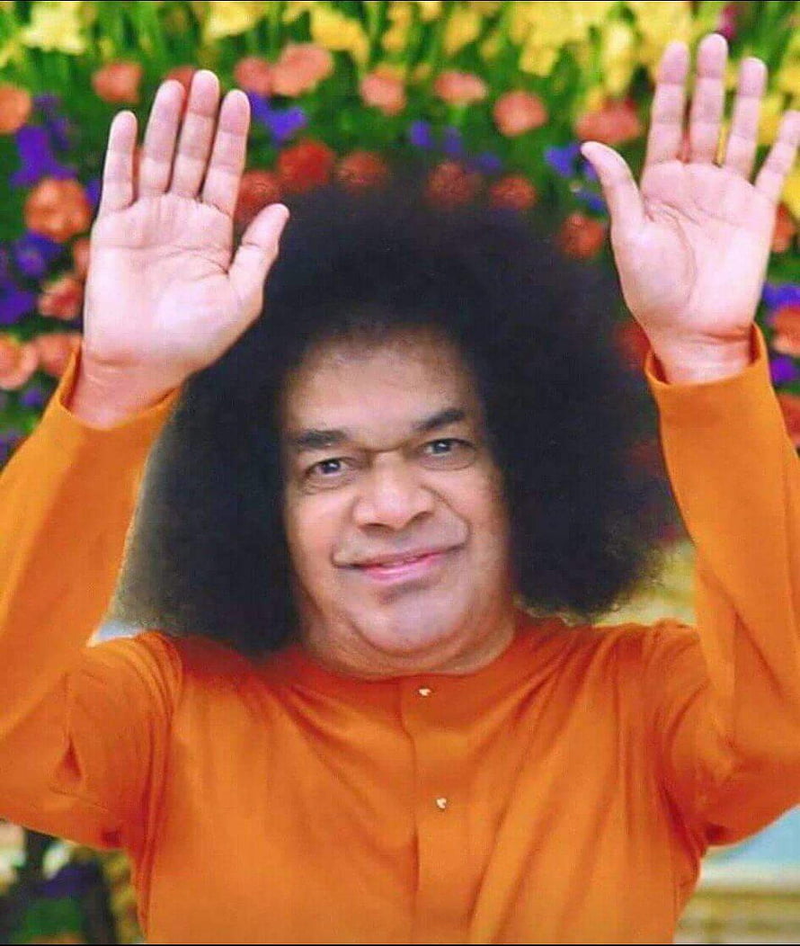 Sathya Sai Baba Portrait with Raised Hands and Vibrant Floral Background HD phone wallpaper