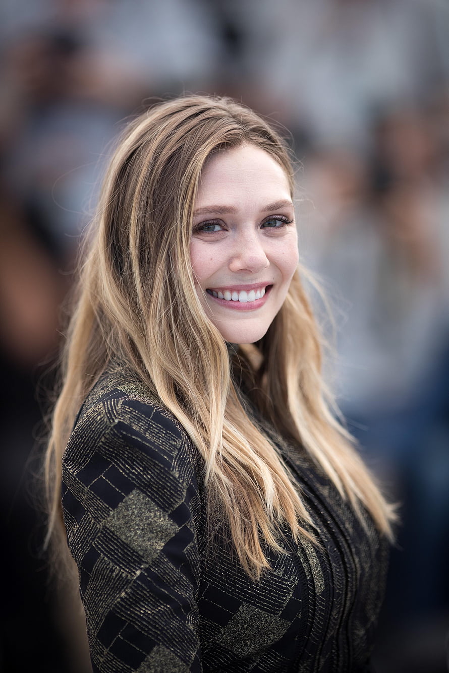 Elizabeth Olsen Smiling Portrait in Black and Gold Patterned Dress HD phone wallpaper