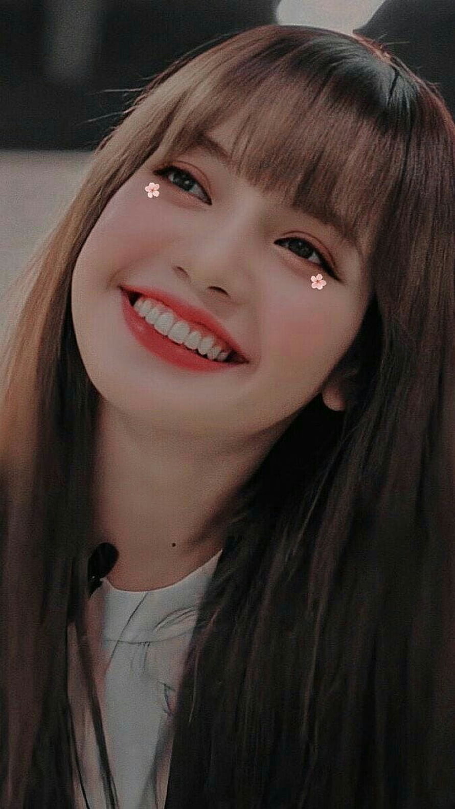 Lisa from BLACKPINK smiling portrait with cherry blossom accents and long brown hair HD phone wallpaper