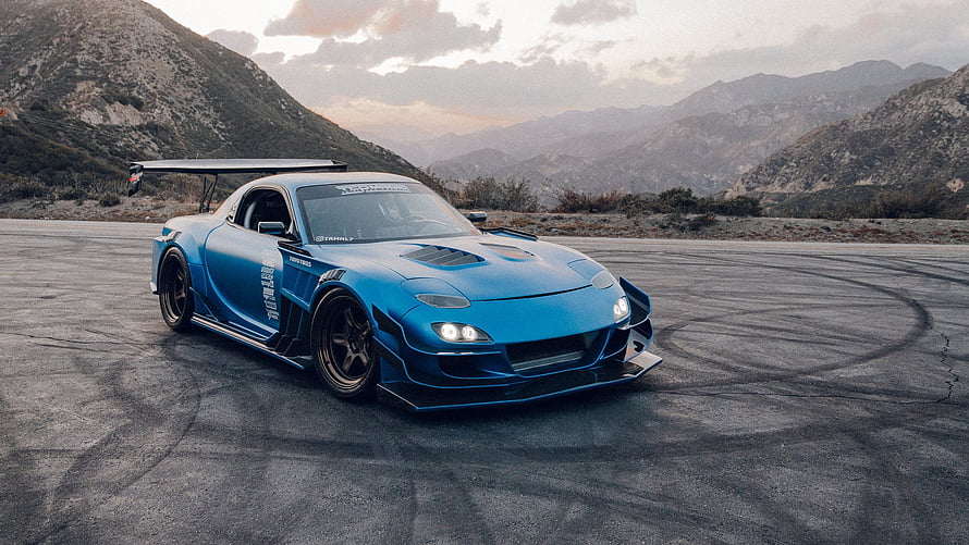 Blue Mazda RX-8 Widebody Drift Car on Mountain Road with Skid Marks HD wallpaper