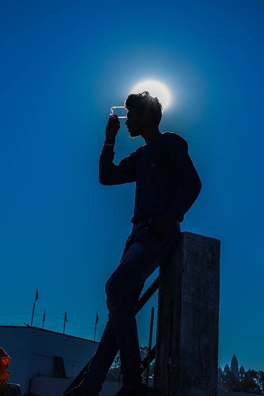 Silhouette of a man holding a phone against the bright sun on a rooftop, 15 Sad Boy For Whatsapp DP, whatsapp dp boys HD phone wallpaper