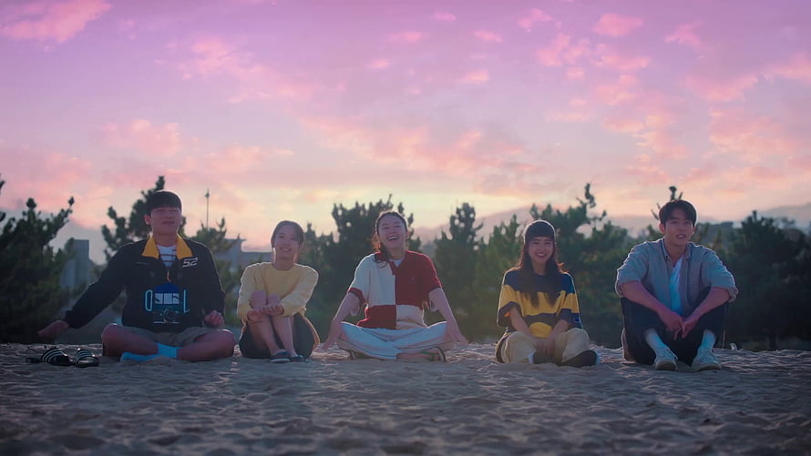 Twenty Five Twenty One Cast Sitting on Beach at Sunset HD wallpaper