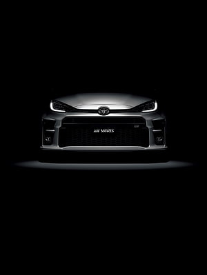 Toyota GR Yaris Front Fascia with LED Headlights in Dramatic Black Studio Lighting HD phone wallpaper