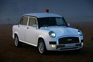 White Electric Taxi with Red Beacon Light in Open Field HD wallpaper