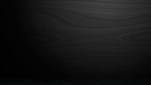 Dark Charcoal Wood Grain Texture with Subtle Vignette and Minimalist Aesthetic HD wallpaper