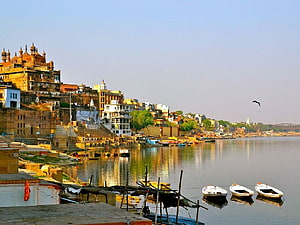Kashi Vishwanath Temple and Varanasi Ghats Along the Ganges River at Golden Hour HD wallpaper