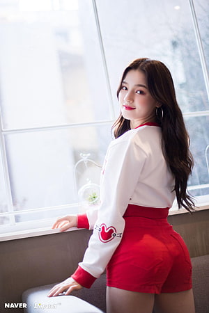 Nancy from Momoland in a white sweatshirt and red shorts posing by a window HD phone wallpaper