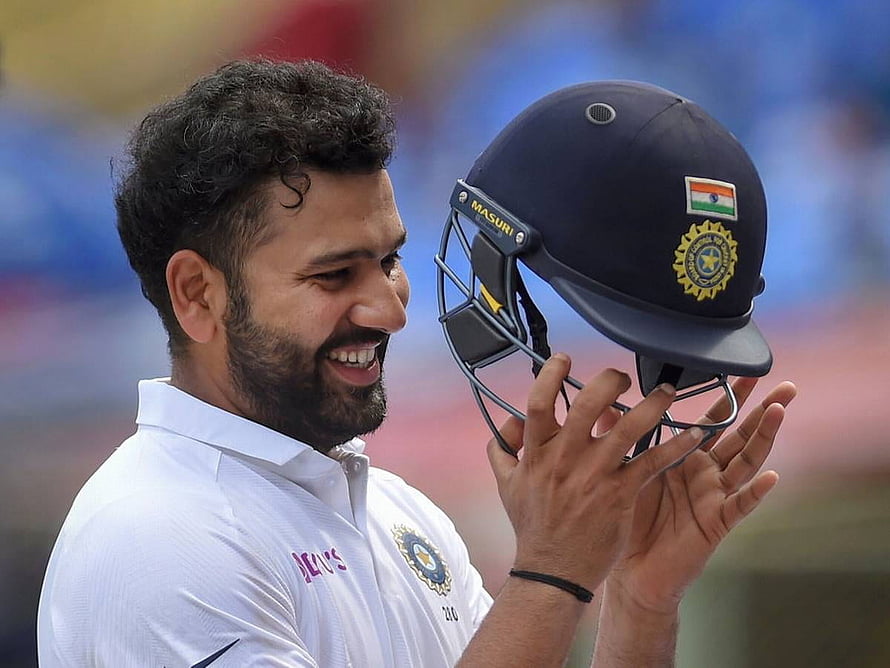 Rohit Sharma Smiling While Holding Indian Cricket Helmet HD wallpaper