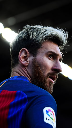 Lionel Messi in Barcelona Kit with La Liga Badge in Dramatic Stadium Lighting HD phone wallpaper