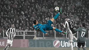 Cristiano Ronaldo performing a spectacular bicycle kick in a teal Real Madrid jersey during a Champions League match against Juventus HD wallpaper