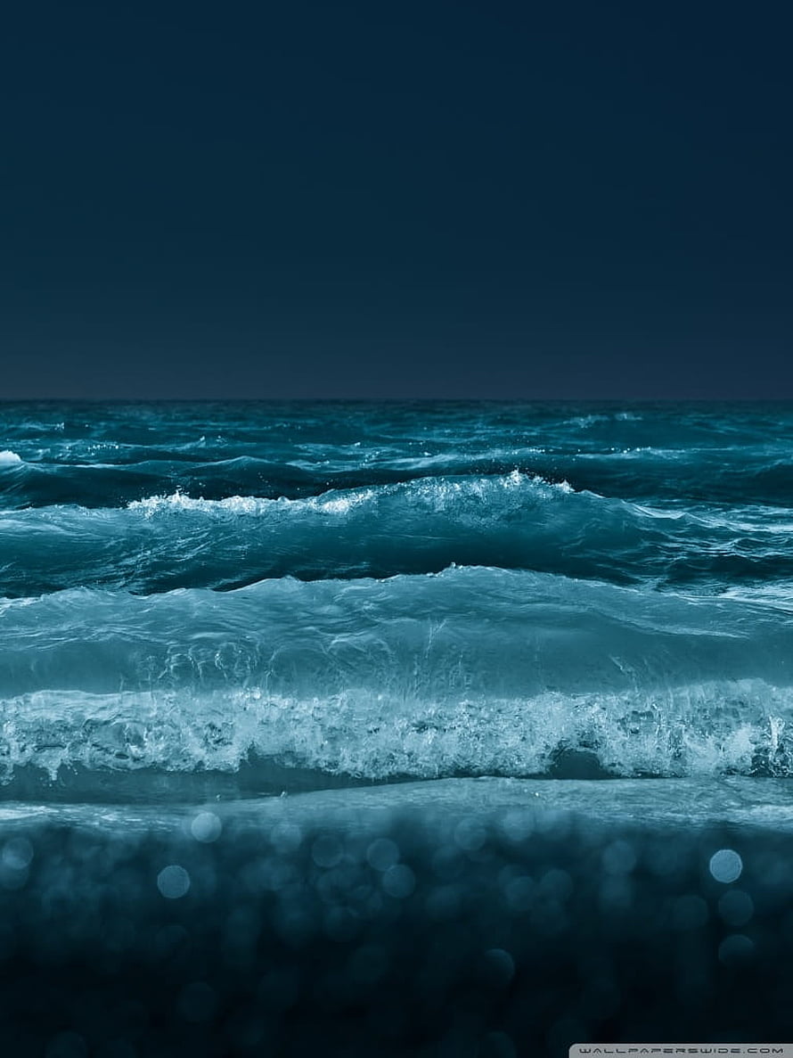Dark Ocean Waves Crashing on Shore Under a Moody Night Sky HD phone wallpaper