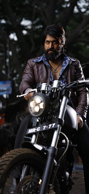 Allu Arjun as Pushpa Raj on a motorcycle in a leather jacket HD phone wallpaper