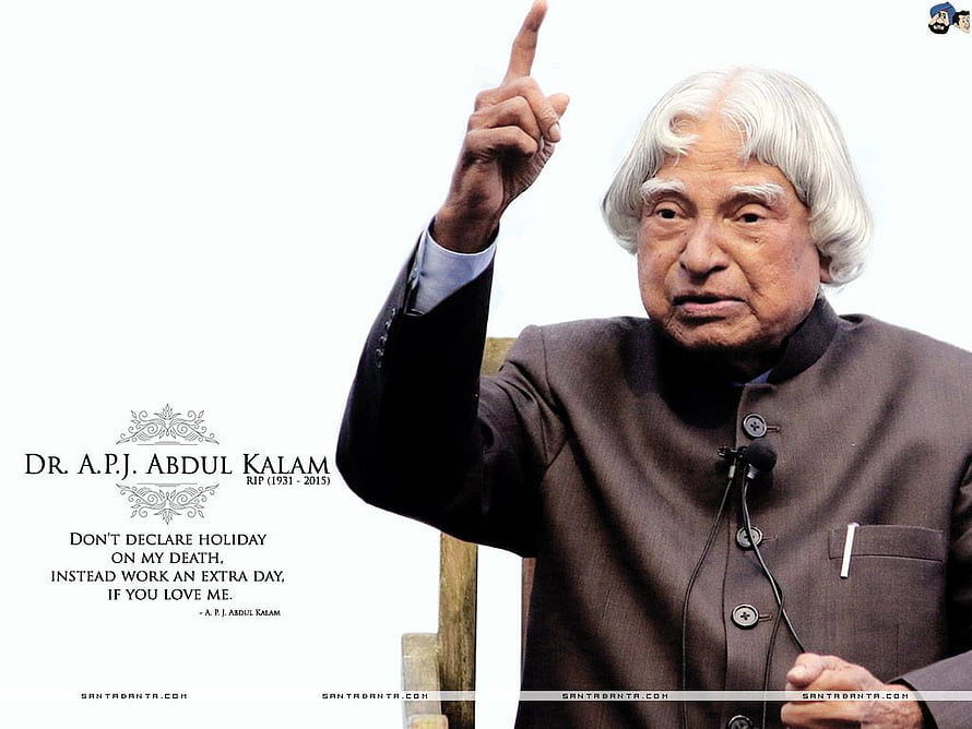 Dr. A.P.J. Abdul Kalam Pointing Upward in Formal Attire with Inspirational Quote HD wallpaper