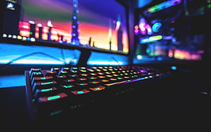 Illuminated RGB Gaming Keyboard Setup With Dual Monitors And Neon Lighting HD wallpaper