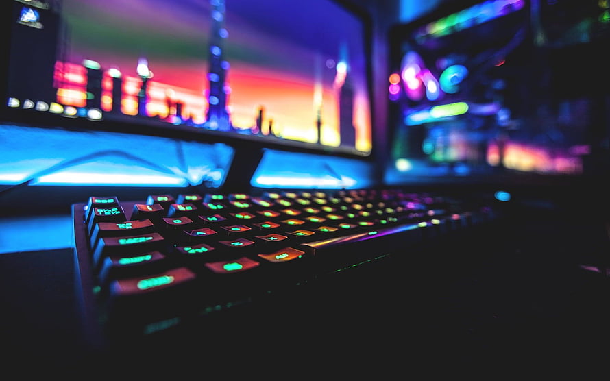 Illuminated RGB Gaming Keyboard Setup With Dual Monitors And Neon Lighting HD wallpaper