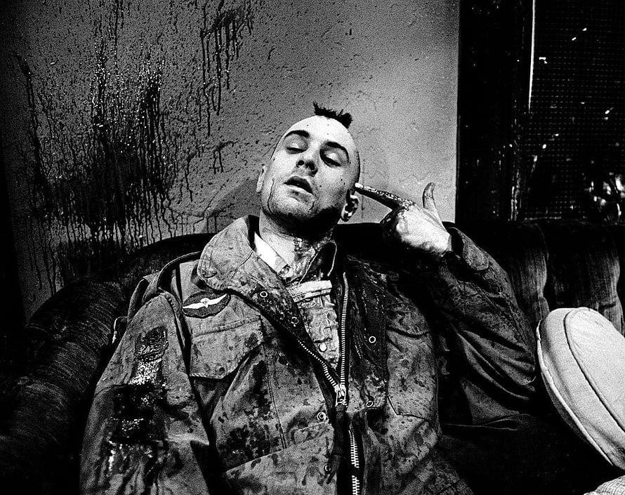 Black and white portrait of a man with a mohawk sitting on a couch holding a gun to his head, 103 Taxi Driver HD wallpaper
