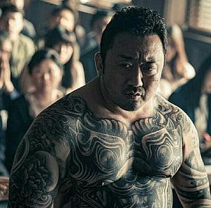 Ma Dong Seok shirtless with full body tattoos in dramatic cinematic lighting HD wallpaper