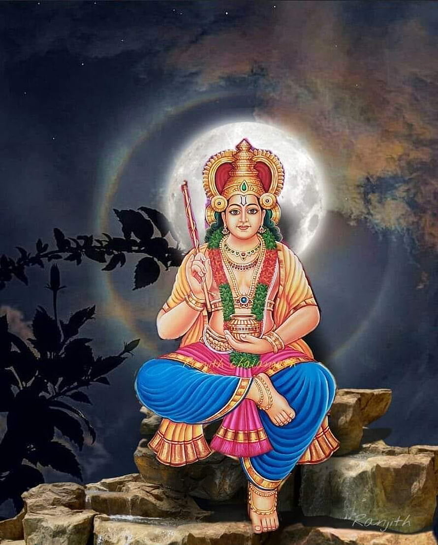 Vishnumaya Deity Seated on Rocks Under a Full Moon with Traditional Attire and Jewelry HD phone wallpaper