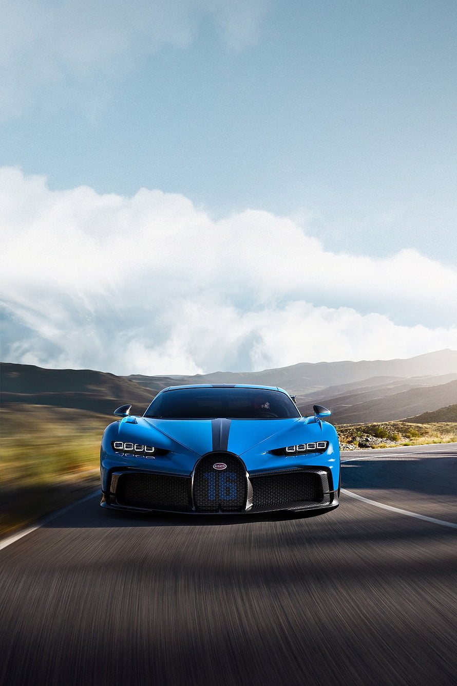 Blue Bugatti Centodieci Hypercar Driving on Scenic Mountain Road HD phone wallpaper