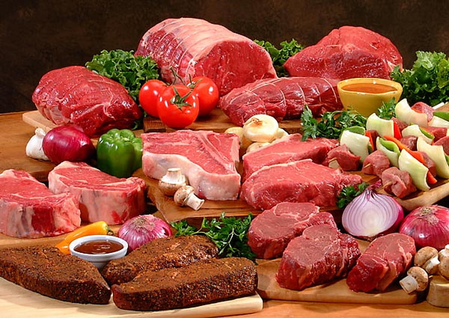 Assorted Raw Beef Cuts and Seasoned Steaks Arranged with Fresh Vegetables on Wooden Boards HD wallpaper